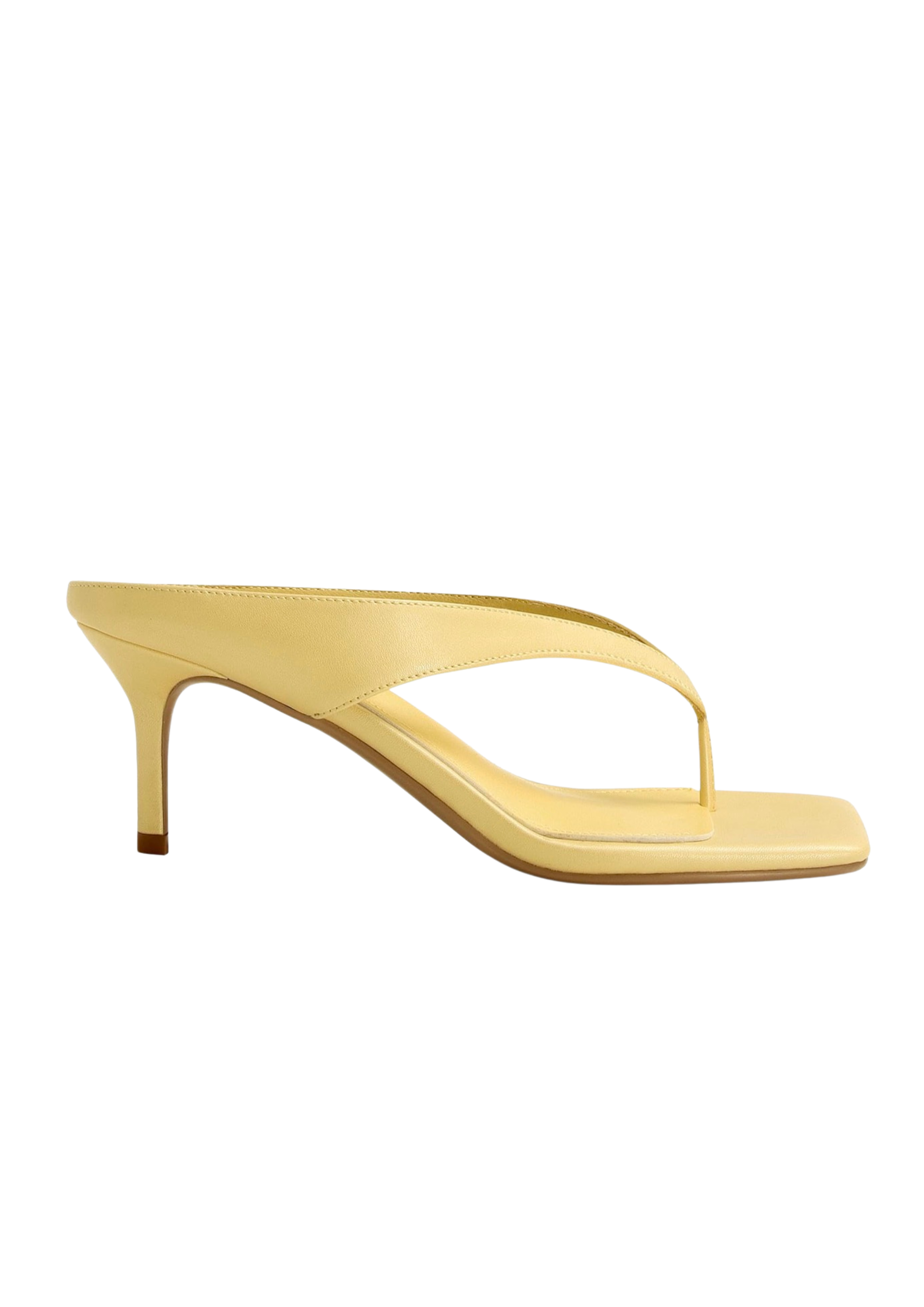 A single pale yellow leather thong sandal with a square toe and a slim kitten heel, shown from a side profile on a solid white background.