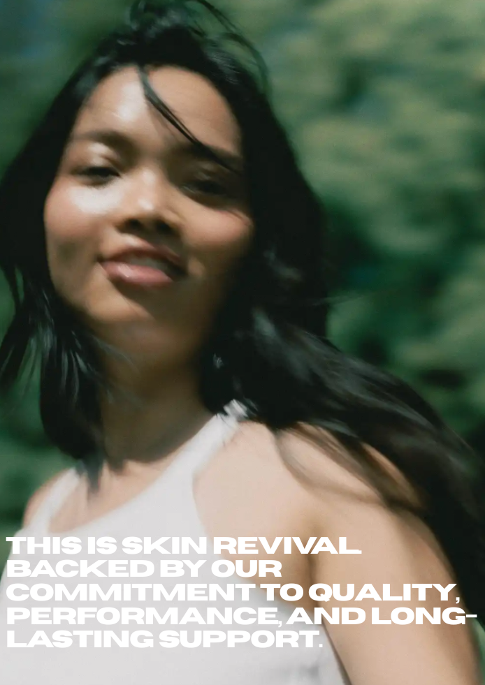 A woman outdoors with a blurred green background, wearing a white sleeveless top. White text overlays read 'THIS IS SKIN REVIVAL BACKED BY OUR COMMITMENT TO QUALITY, PERFORMANCE, AND LONG-LASTING SUPPORT.