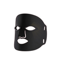 A matte black silicone or rubber face mask with eye, nose, and mouth cutouts, featuring a subtle dotted line pattern on the cheek area, shown against a plain white background.